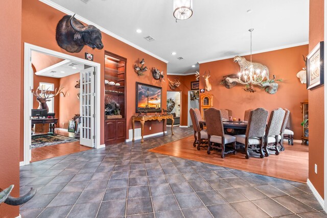 6263 Fm 934, Milford, TX 76670 - dining room with recessed lighting, tile patterned flooring, an inviting chandelier, visible vents, and ornamental molding