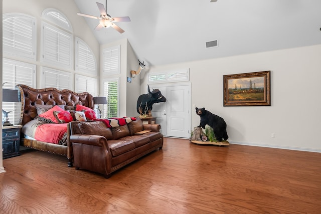 6263 Fm 934, Milford, TX 76670 - bedroom with wood finished floors, visible vents, baseboards, high vaulted ceiling, and ceiling fan