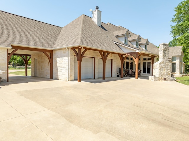 6263 Fm 934, Milford, TX 76670 - exterior space with driveway, stone siding, a chimney, and a shingled roof
