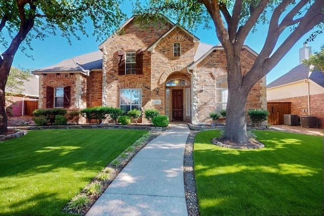 1206 Greenway Dr, Allen, TX 75013 - view of front of property featuring brick siding and central air condition unit
