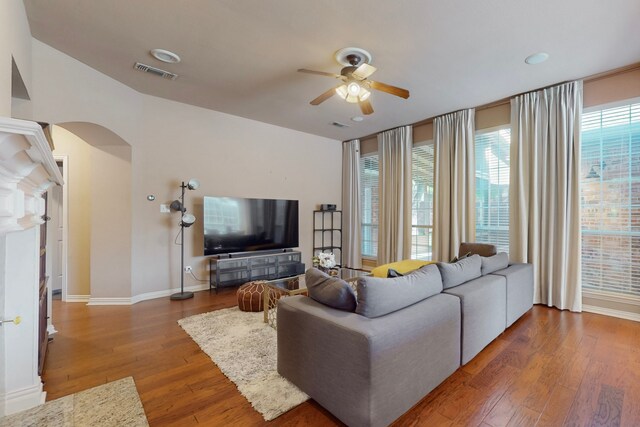 1206 Greenway Dr, Allen, TX 75013 - living area featuring arched walkways, a ceiling fan, hardwood / wood-style floors, baseboards, and recessed lighting