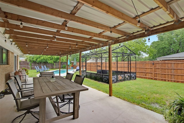 view of patio featuring a fenced in pool, outdoor dining area, and a fenced backyard
