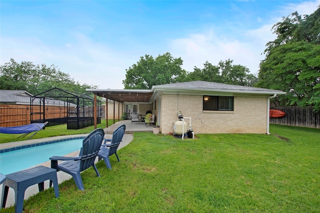 rear view of house featuring a fenced backyard, a gazebo, a yard, and a patio area