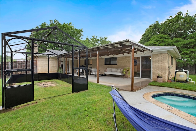 back of property with brick siding, a lawn, a pergola, and an outdoor hangout area