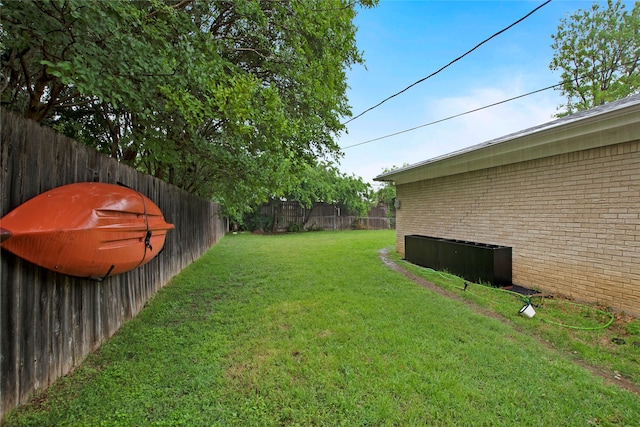 view of yard featuring a fenced backyard