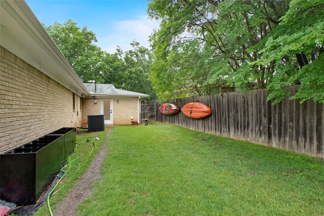 view of yard featuring cooling unit and a fenced backyard