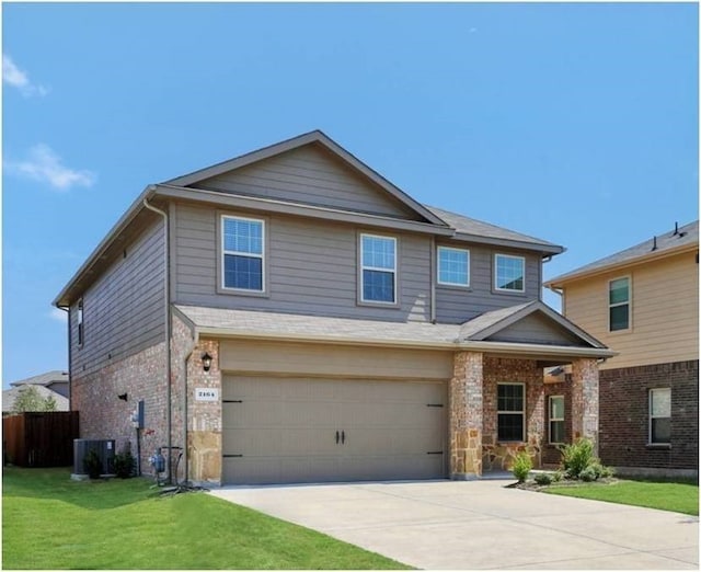 craftsman inspired home featuring concrete driveway, an attached garage, brick siding, and a front yard