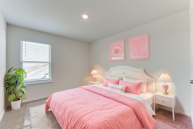 bedroom with carpet flooring and baseboards