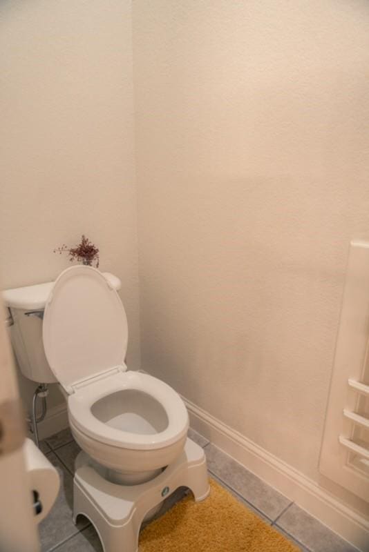 436 Dakota Dr, Murphy, TX 75094 - bathroom featuring baseboards, toilet, and tile patterned flooring