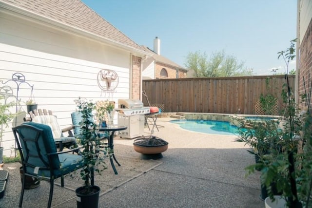 436 Dakota Dr, Murphy, TX 75094 - view of pool featuring grilling area, a patio, a fenced backyard, and a pool with connected hot tub