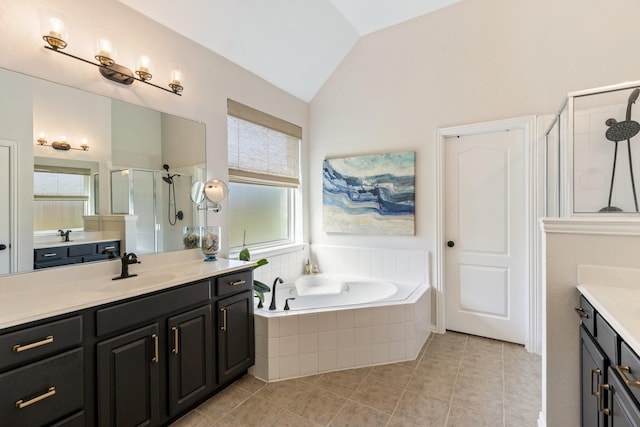 full bath featuring a shower stall, lofted ceiling, a sink, a bath, and two vanities
