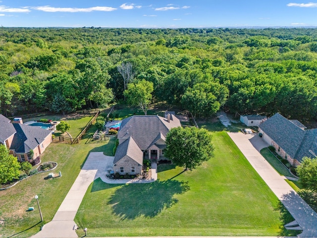 aerial view featuring a wooded view