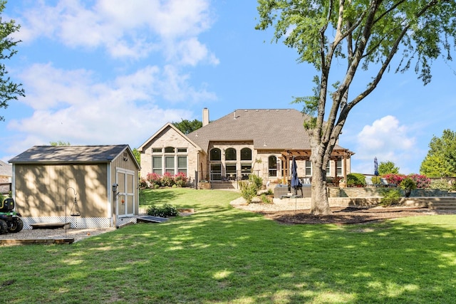 rear view of property featuring a pergola, a lawn, an outdoor structure, a patio, and a storage unit