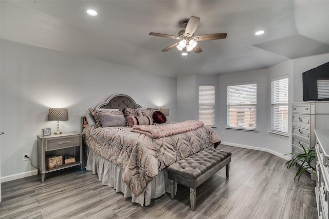 bedroom featuring recessed lighting, baseboards, a ceiling fan, and light wood-type flooring