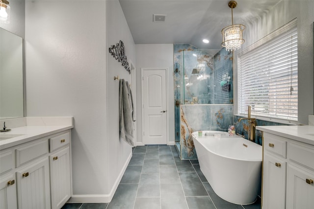 full bathroom featuring a chandelier, two vanities, visible vents, and a stall shower