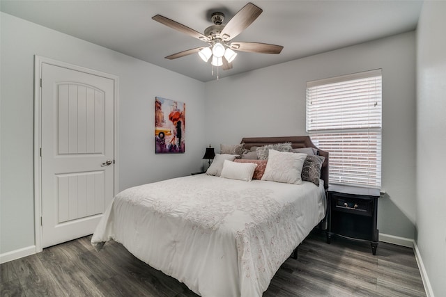 bedroom with baseboards, a ceiling fan, and wood finished floors