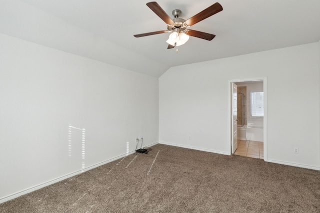 unfurnished room featuring a ceiling fan, baseboards, light colored carpet, and lofted ceiling