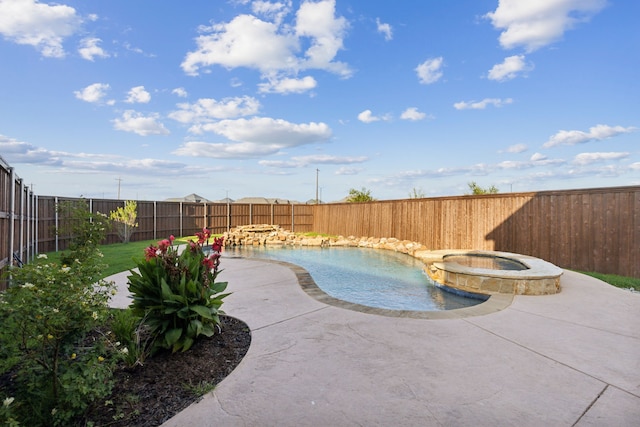 view of pool with a patio, a pool with connected hot tub, and a fenced backyard