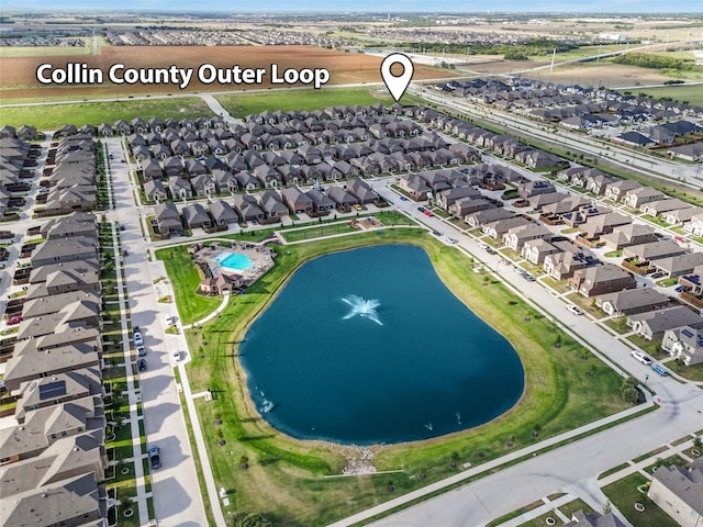 aerial view featuring a water view and a residential view