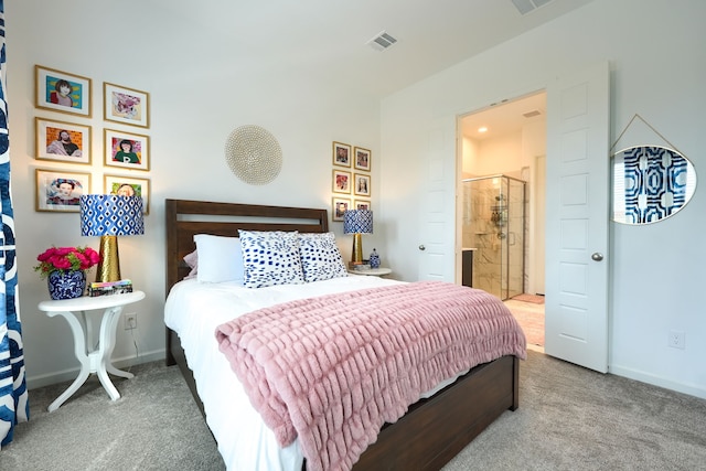 carpeted bedroom featuring baseboards and visible vents