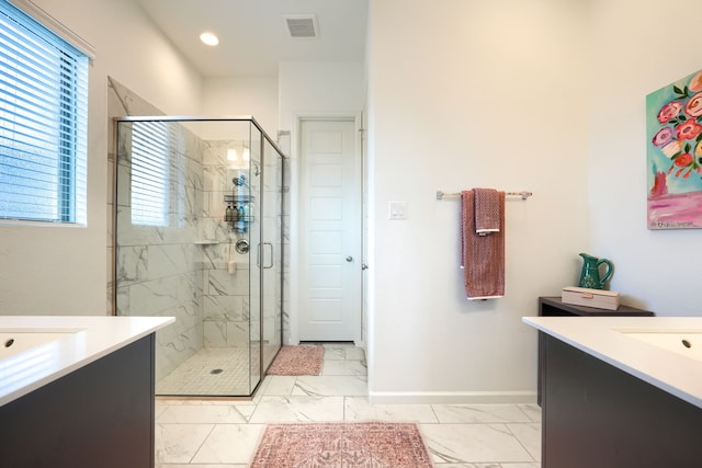 full bathroom featuring visible vents, marble finish floor, a stall shower, and vanity