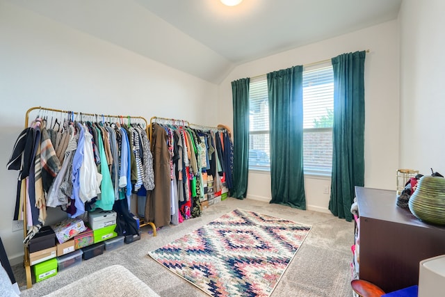 spacious closet featuring carpet floors and vaulted ceiling