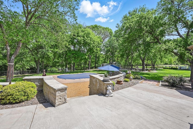 view of patio / terrace featuring fence