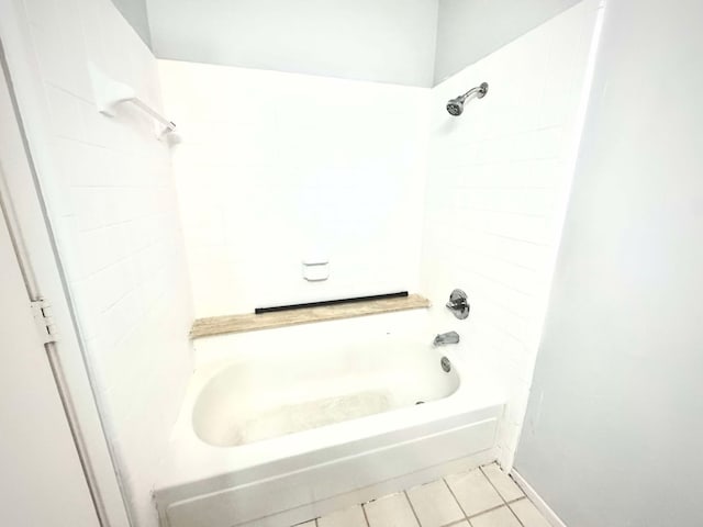 bathroom featuring tile patterned flooring and shower / bath combination