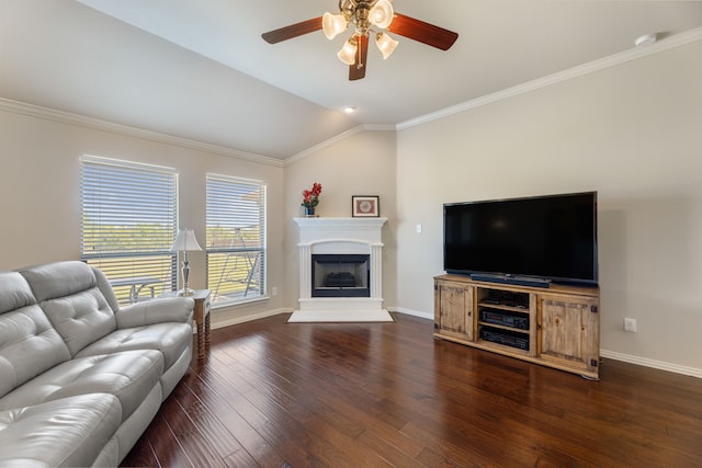 living room with lofted ceiling, a fireplace with raised hearth, wood-type flooring, baseboards, and ceiling fan