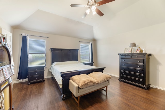 bedroom with lofted ceiling, a ceiling fan, baseboards, and dark wood finished floors