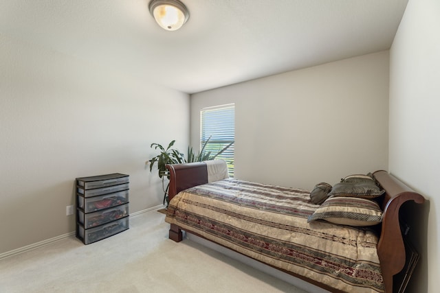 bedroom with carpet and baseboards