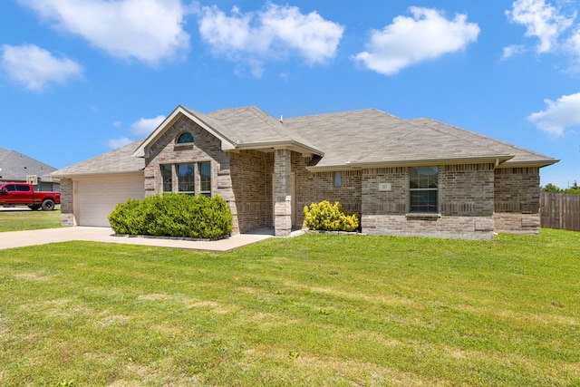 ranch-style home featuring an attached garage, a front lawn, brick siding, and concrete driveway