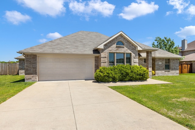 single story home featuring a garage, a front lawn, concrete driveway, and fence
