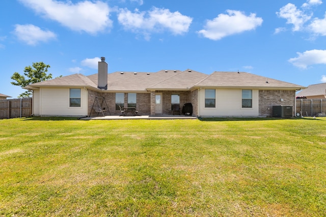 rear view of house featuring fence, a patio area, a chimney, and cooling unit