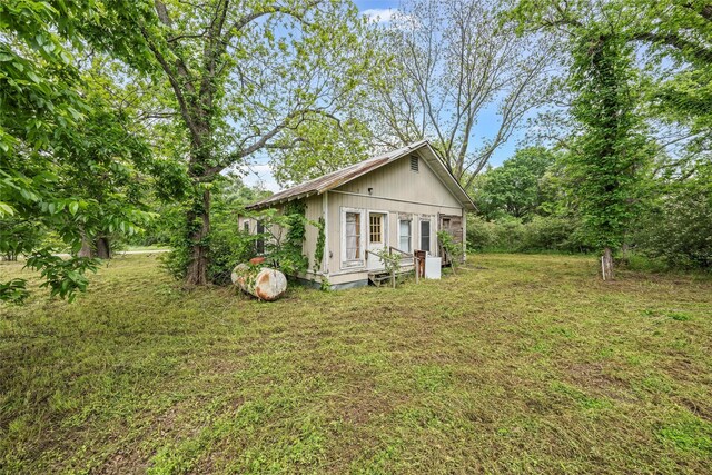 1605 Tyler St, Thornton, TX 76687 - view of property exterior featuring a yard