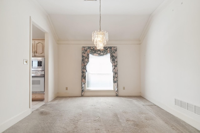 unfurnished dining area featuring visible vents, carpet flooring, ornamental molding, and an inviting chandelier