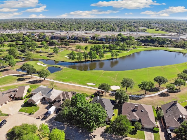 drone / aerial view with a residential view, a water view, and view of golf course