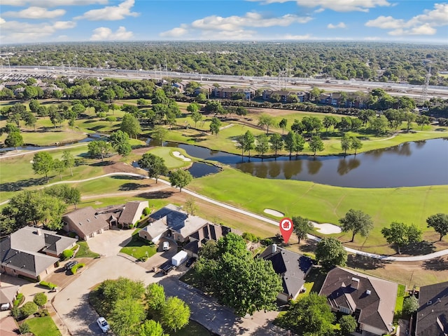 birds eye view of property featuring golf course view, a water view, and a residential view