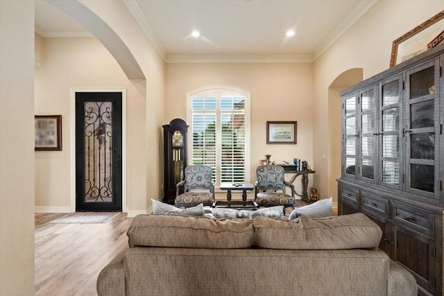 1608 Ridgewood Dr, Waco, TX 76710 - living room with baseboards, wood finished floors, arched walkways, and ornamental molding