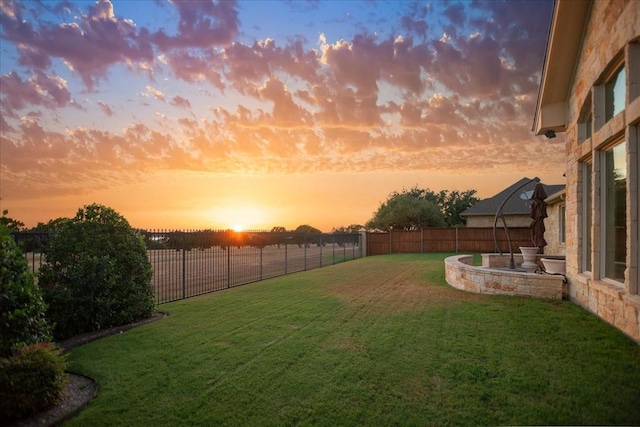 1608 Ridgewood Dr, Waco, TX 76710 - yard at dusk with a fenced backyard