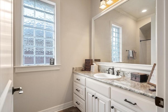 1608 Ridgewood Dr, Waco, TX 76710 - full bathroom featuring walk in shower, baseboards, crown molding, and vanity
