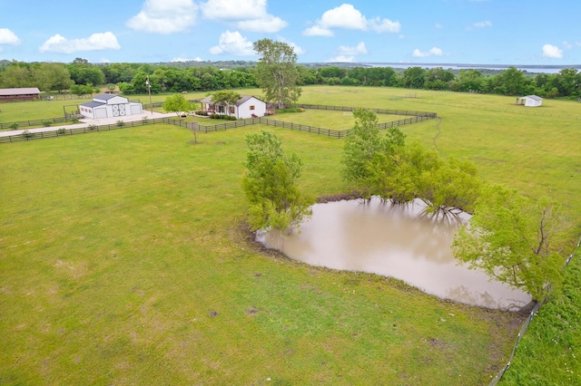 birds eye view of property with a water view and a rural view
