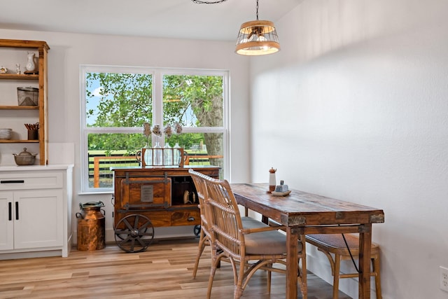 dining area with light wood-style floors