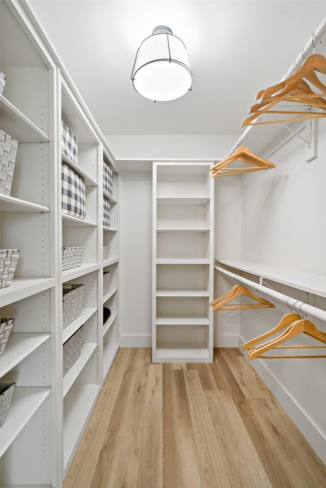 spacious closet featuring light wood-type flooring