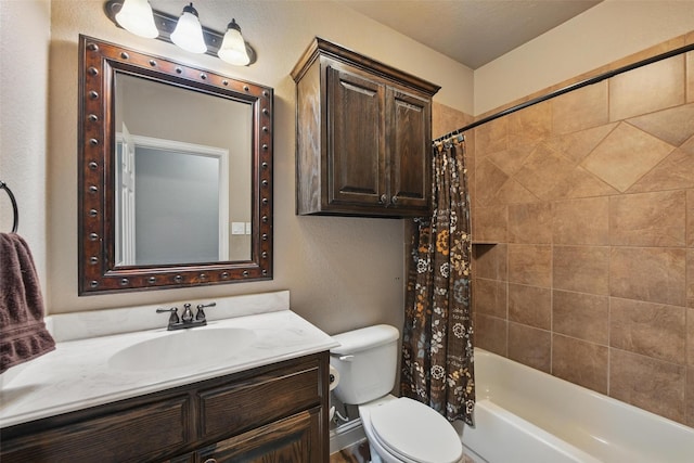 full bath featuring shower / bath combo with shower curtain, vanity, and toilet