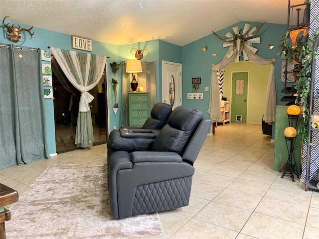 living room with lofted ceiling, a textured ceiling, and tile patterned floors