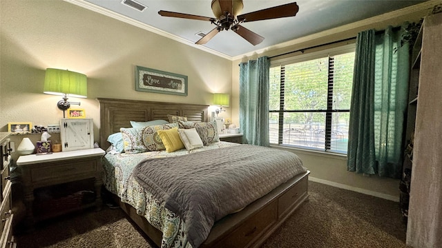 bedroom featuring dark colored carpet, visible vents, a ceiling fan, crown molding, and baseboards