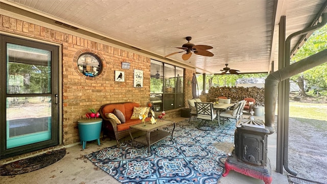 view of patio with a ceiling fan and outdoor lounge area