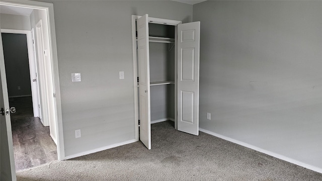 805 S 4th St, Bonham, TX 75418 - unfurnished bedroom featuring baseboards, a closet, and carpet
