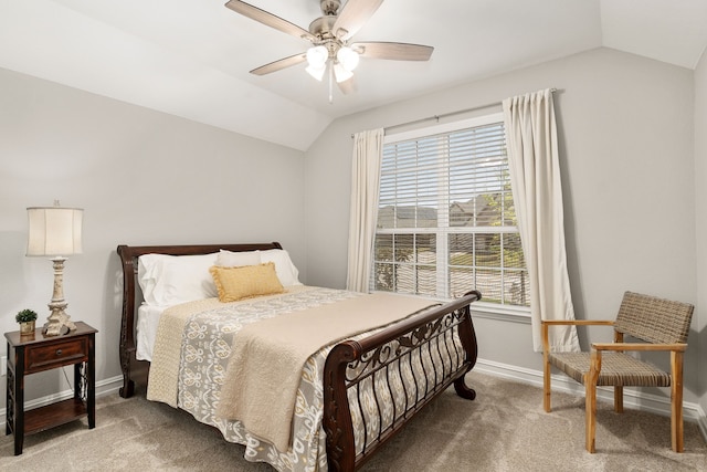 carpeted bedroom featuring lofted ceiling, a ceiling fan, multiple windows, and baseboards